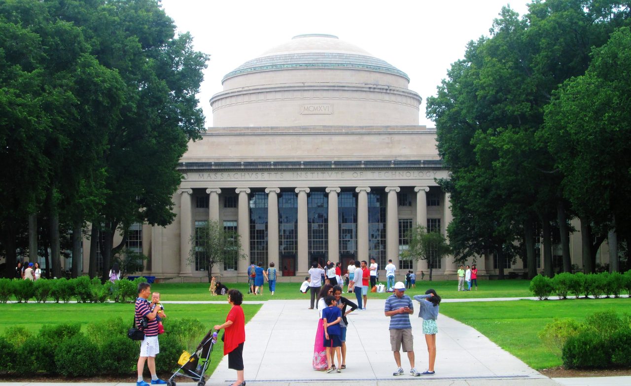 The Great Dome of the Massachusetts Institute of Technology rising above Killian Court under a blue sky