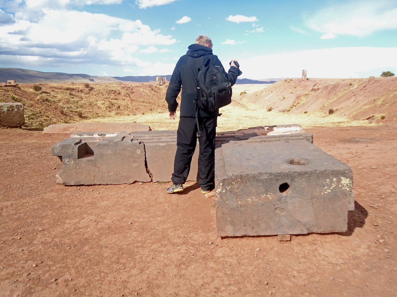 Cut and carved stone blocks with straight edges and channels at Puma Punku in Bolivia.