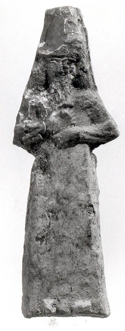 A small Assyrian ceramic Apkallu figure wearing a fish-skin hood, in the Metropolitan Museum of Art