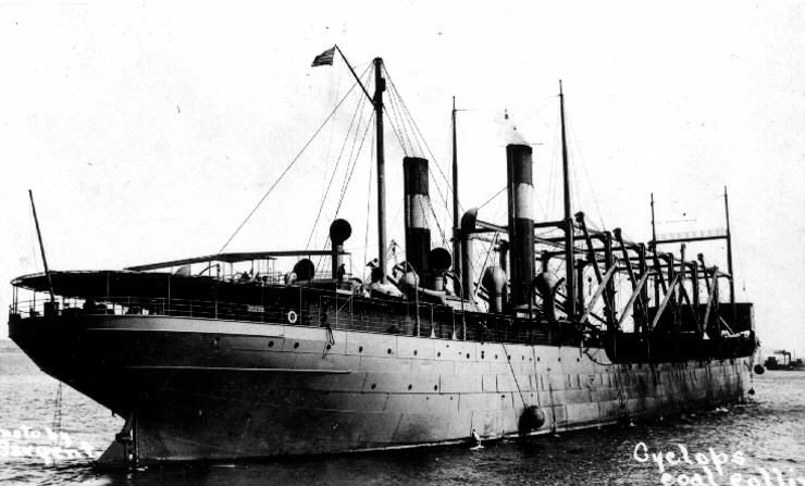 The U.S. Navy collier USS Cyclops photographed around 1913, a large steam-powered coaling ship with tall cargo derricks