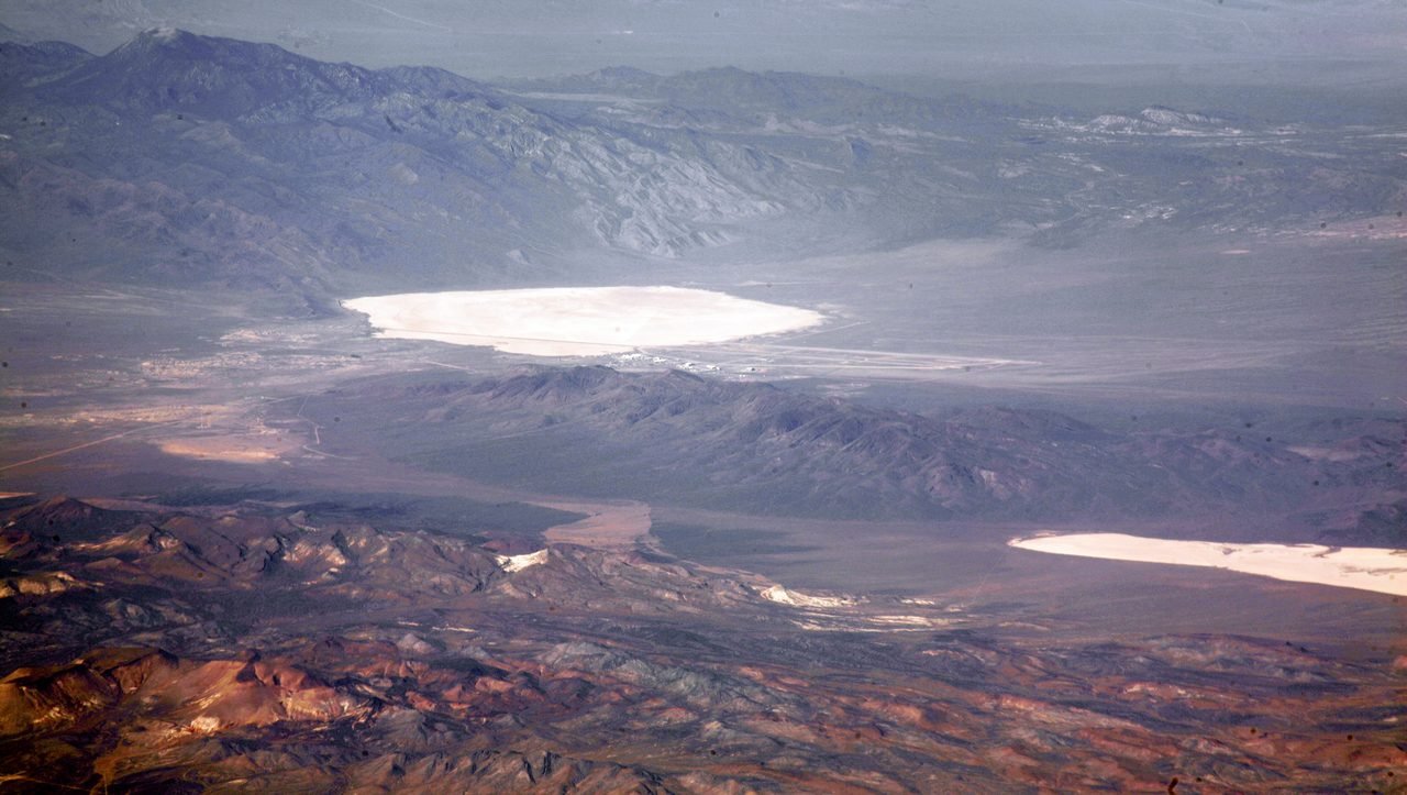 An aerial photograph of the Nevada Test and Training Range showing both Groom Lake and Papoose Lake.