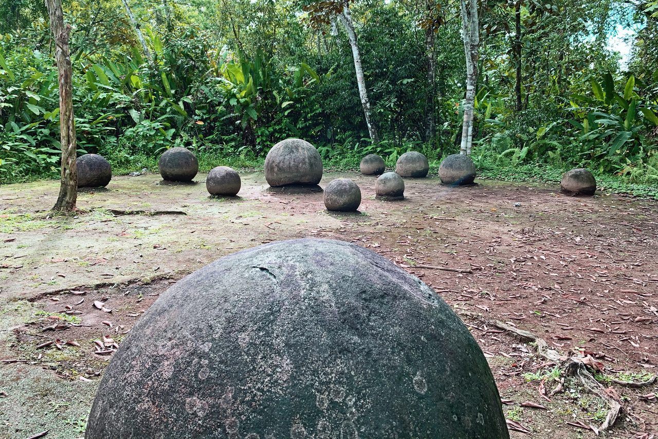 Diquis stone spheres photographed in situ at the Finca 6 archaeological site, showing their original spatial arrangement