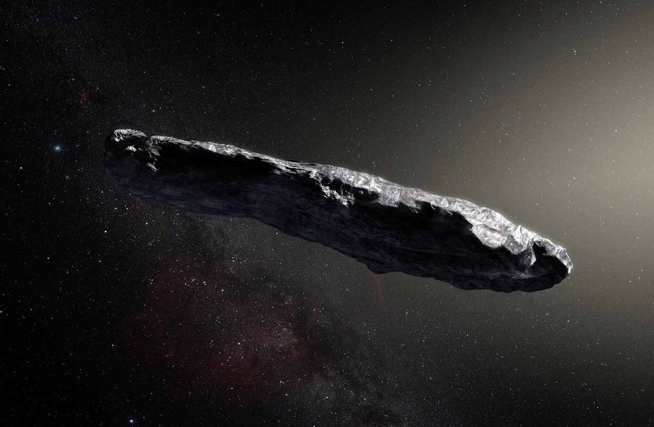 An artist's impression of the interstellar object 1I/'Oumuamua, an elongated grey body tumbling against a starfield.
