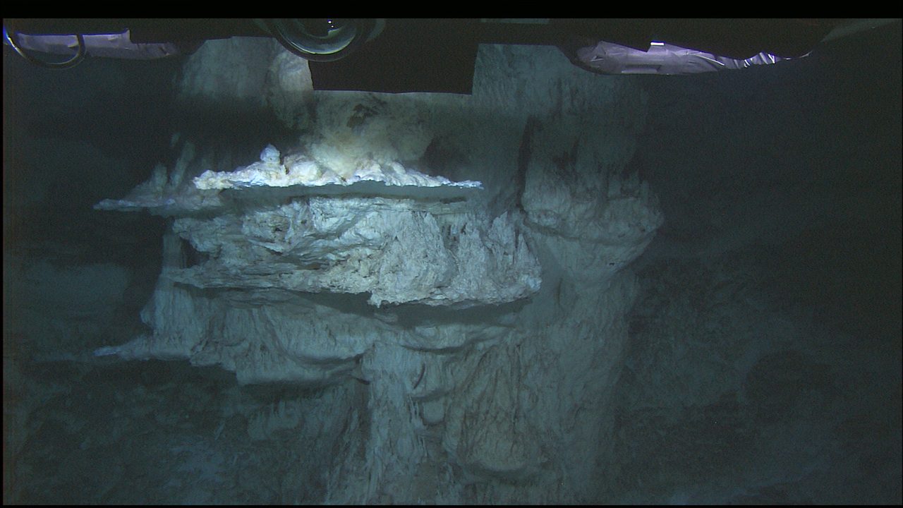 A tall, pale carbonate chimney formation at the Lost City Hydrothermal Field on the Mid-Atlantic Ridge.