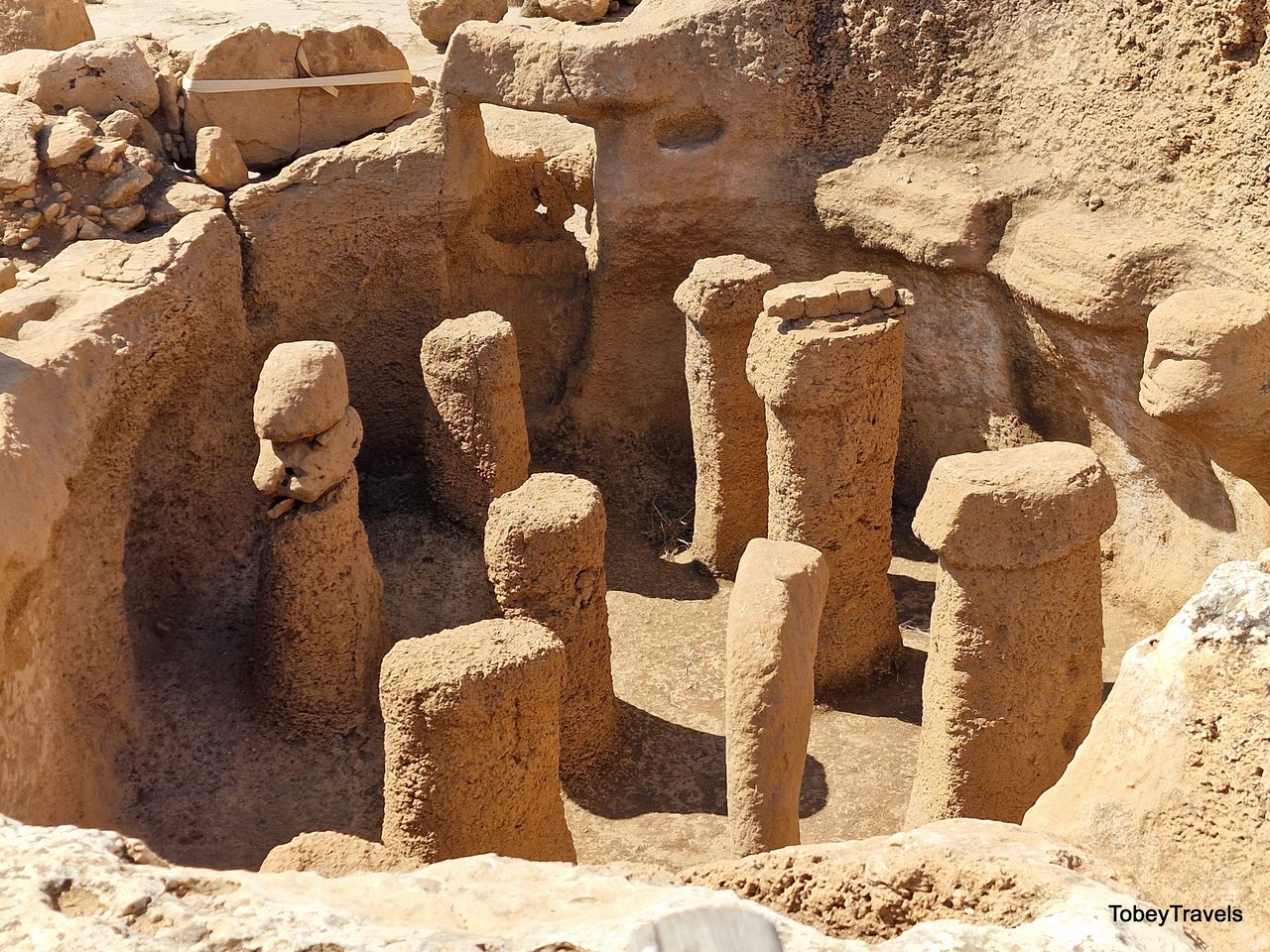 The subterranean Structure AB chamber at Karahan Tepe, with carved pillars rising from the bedrock floor