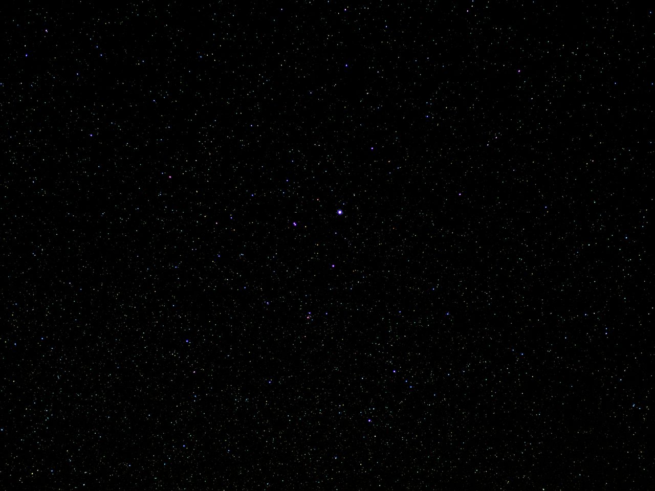 A night-sky photograph of the constellation Lyra, with its brightest star Vega blazing overhead
