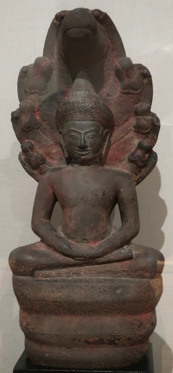 Muchilinda Buddha sculpture, Bayon-style sandstone, Angkor kingdom, 12th century CE, Honolulu Museum of Art
