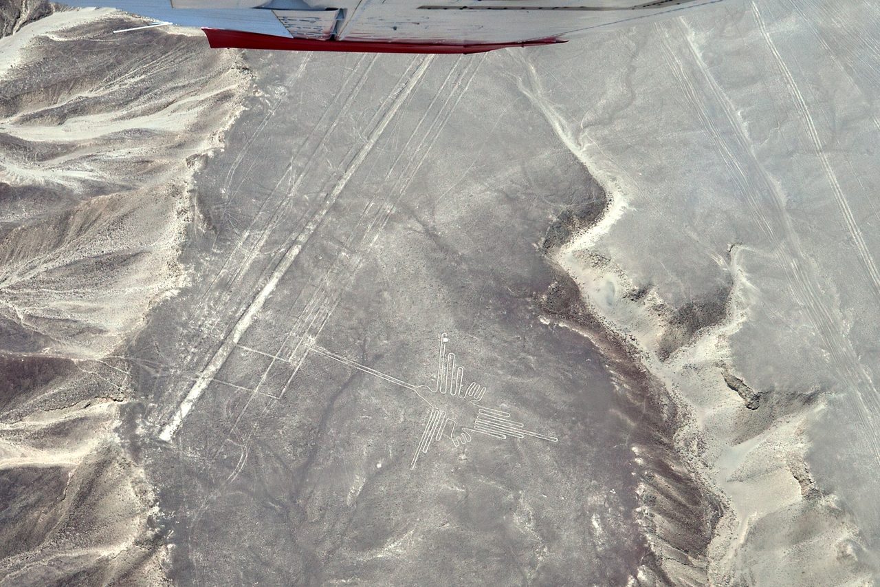 Aerial view of the Nazca hummingbird geoglyph etched into the desert floor of southern Peru