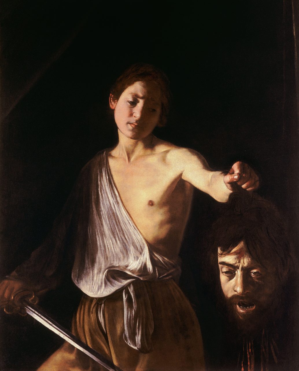 Caravaggio's oil painting David with the Head of Goliath, showing David holding the severed head of Goliath