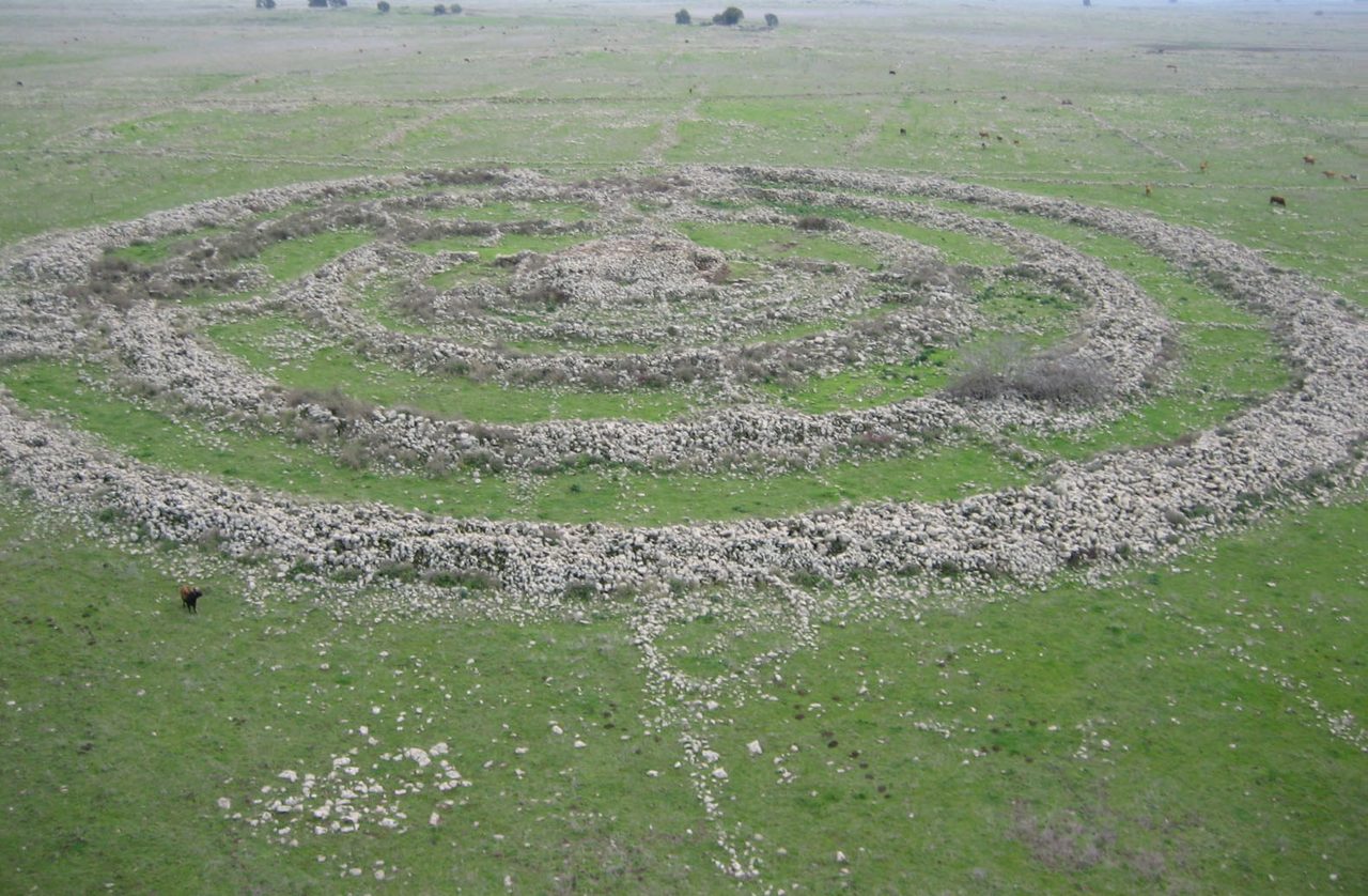 An aerial photograph of Gilgal Refaim, also called Rujm el-Hiri, a monument of concentric basalt stone circles with a central mound in the Golan Heights