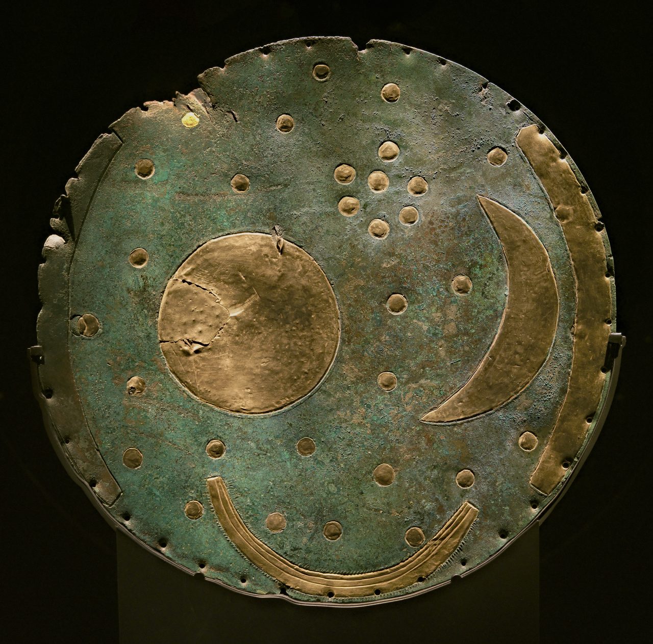 The Nebra Sky Disc, a bronze disc inlaid with gold symbols of the sun, moon, and stars