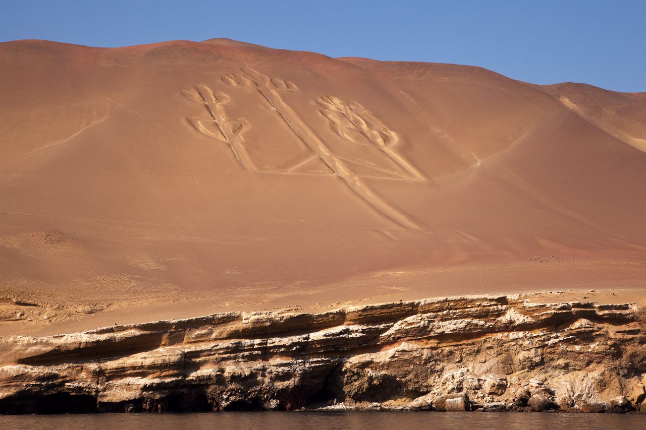 The Paracas Candelabra geoglyph, a three-pronged figure carved into a coastal hillside on the Paracas Peninsula, Peru