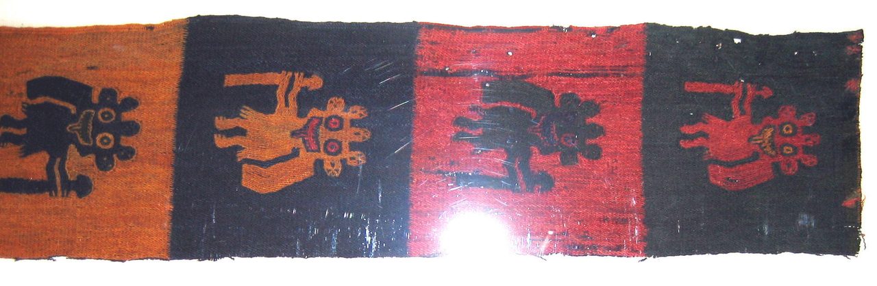 A Paracas culture textile border fragment showing figures holding staffs, 4th to 3rd century BCE