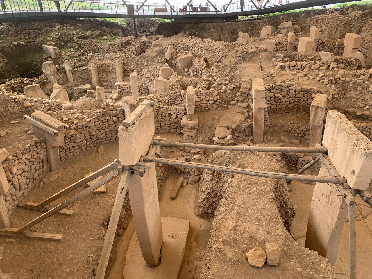 The excavated stone ring of Enclosure D at Gobekli Tepe with T-shaped limestone pillars