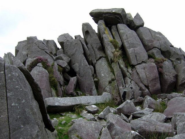Frost-split dolerite slabs stacked naturally at the Carn Menyn outcrop in the Preseli Hills, Wales