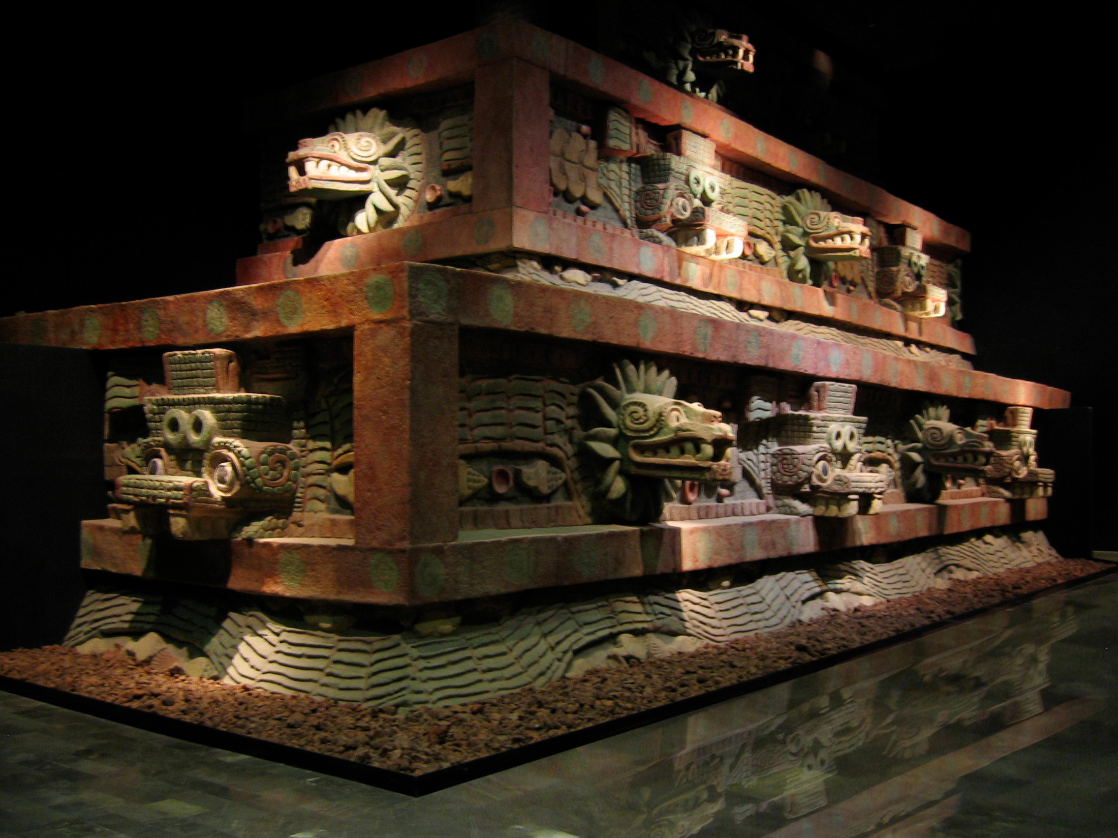 The serpent-head facade of the Temple of the Feathered Serpent, Teotihuacan, shown in a museum reconstruction