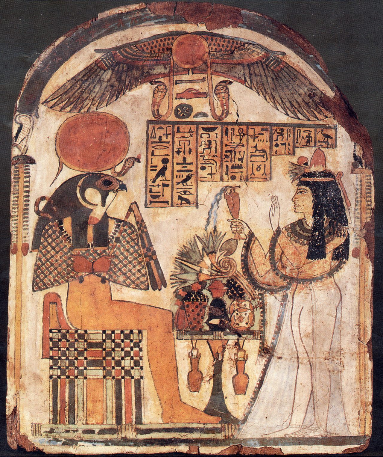 Ra-Horakhty, the falcon-headed Egyptian sun god crowned with a solar disc, painted on an ancient Egyptian funerary stela