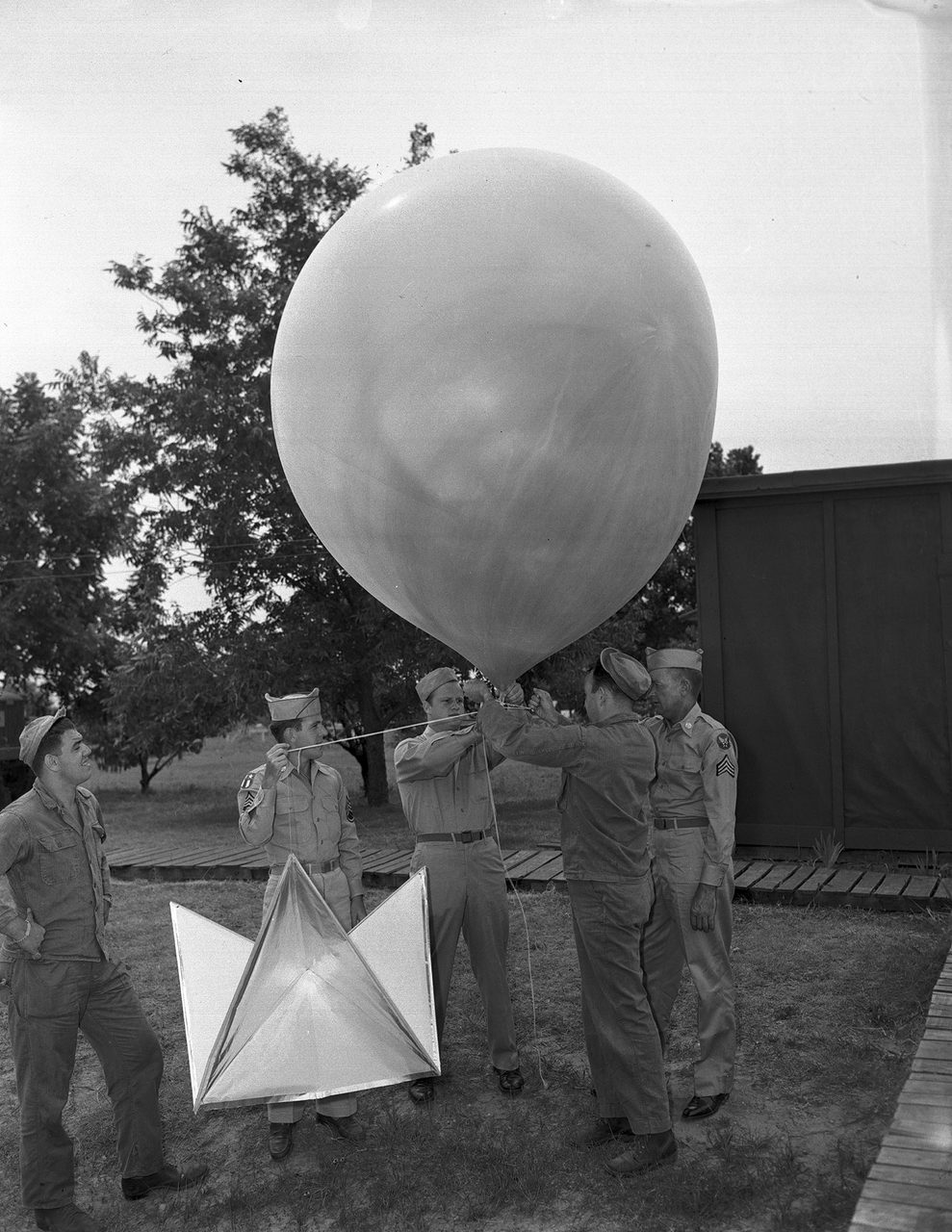 Airmen with a weather balloon at Fort Worth Army Air Field, photographed July 11, 1947