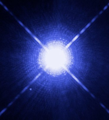Hubble Space Telescope image of Sirius A, the bright star, and its faint white dwarf companion Sirius B, visible as a small point of light nearby