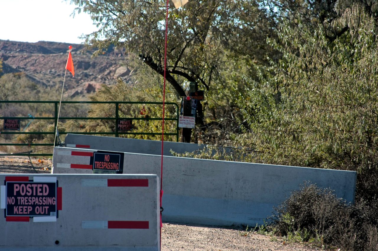 Perimeter fencing and warning signage at the Sherman Ranch property, Utah