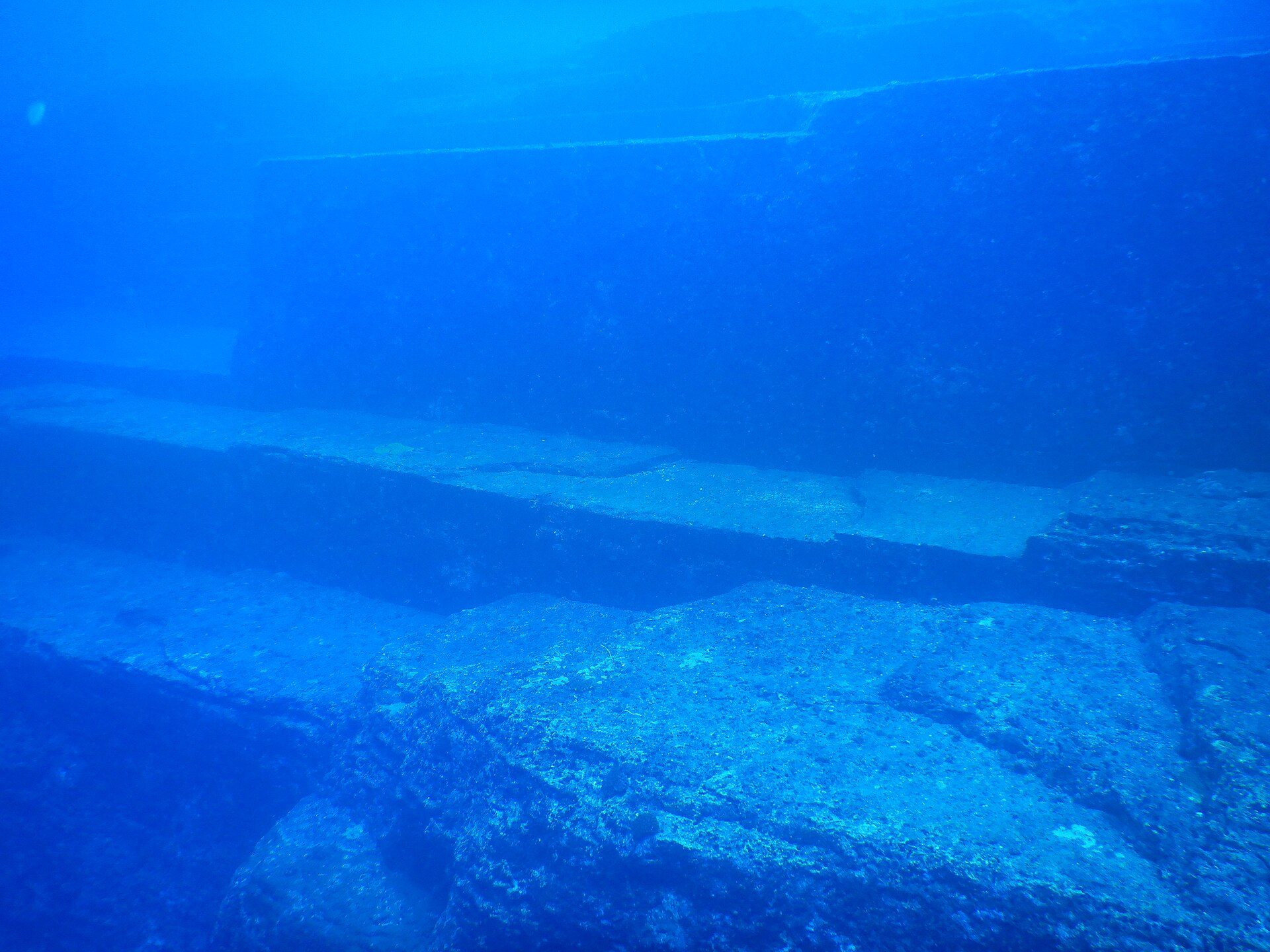 Stepped rock terraces of the Yonaguni Monument seen underwater from the northwest