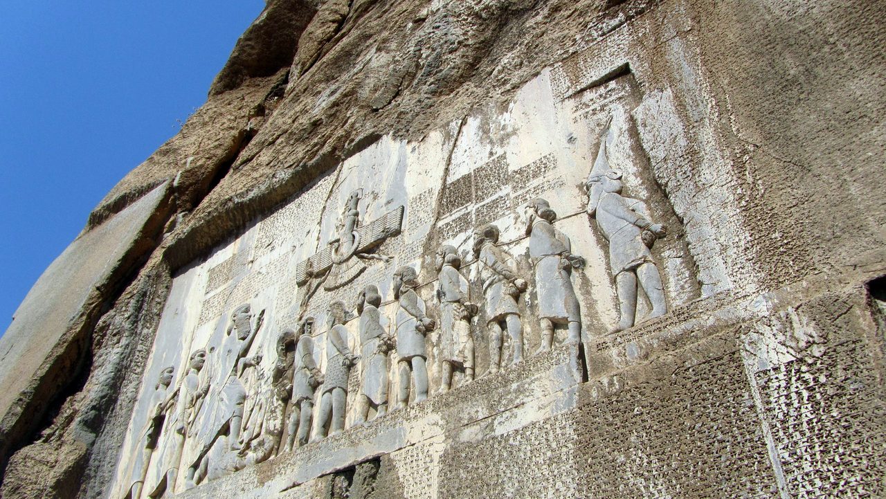 The Behistun Inscription, a giant trilingual cuneiform text carved into a cliff face in western Iran