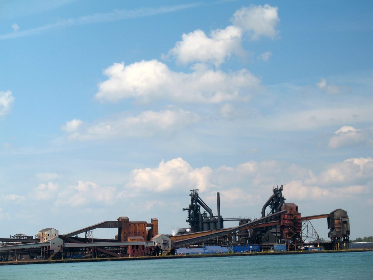 The Detroit skyline and Zug Island's industrial structures seen across the water from Brighton Beach on the Windsor, Ontario side of the river