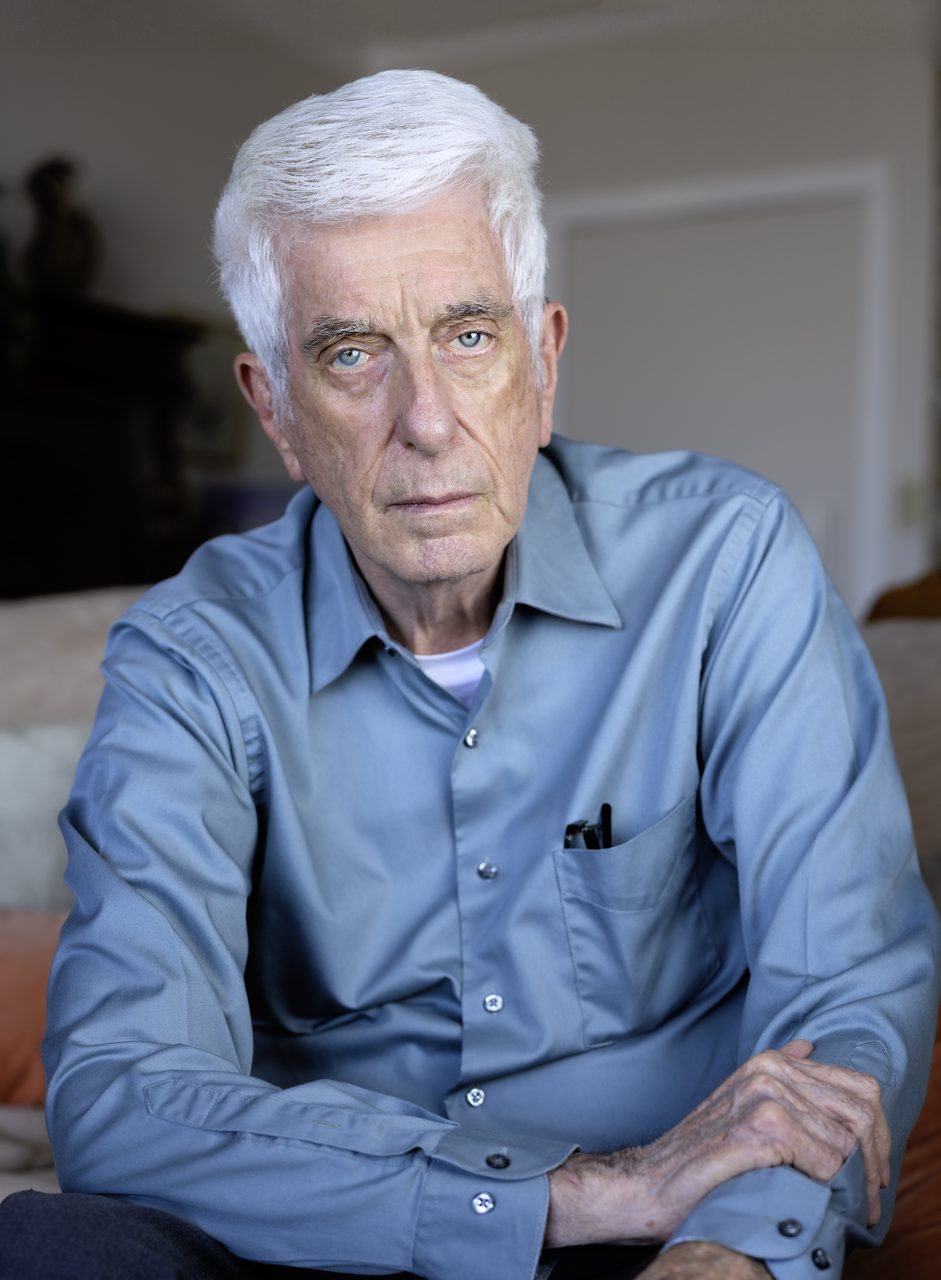 A 2024 portrait photograph of Jacques Vallee, an older man with glasses looking toward the camera