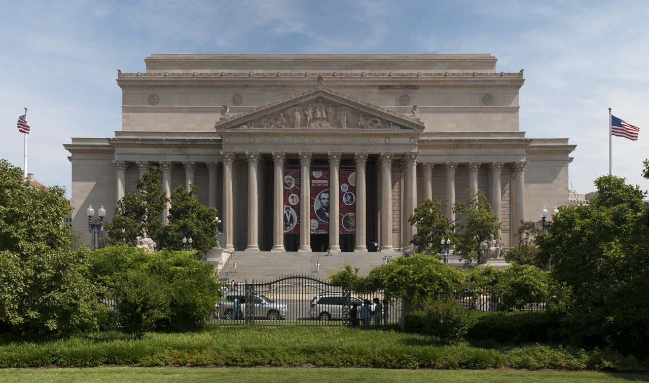 The National Archives building in Washington, D.C., its Corinthian columns and pediment reading Archives of the United States of America