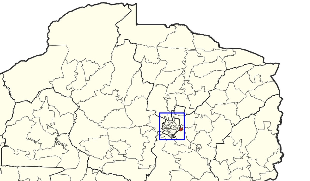 A constituency map of northern Zimbabwe with one small constituency shaded red inside a boxed cluster of urban constituencies, at the cluster's eastern edge